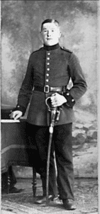 19th-century soldier in dress uniform holding sword