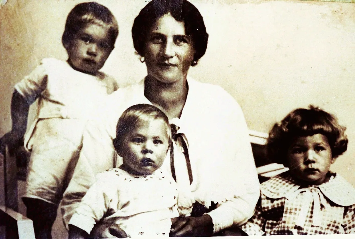Vintage mother with three young children portrait