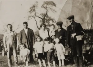 Vintage multi-generational family portrait outdoors