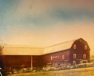 Vintage red barn on sunlit farm