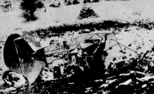 Snow-covered biplane wreck on hillside