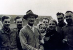 Vintage family portrait with smiling adults and child