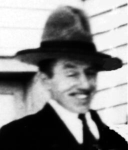 Vintage smiling man in fedora and suit
