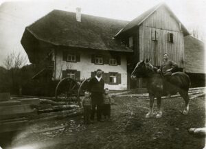 Vintage farmhouse family with horse and wagon