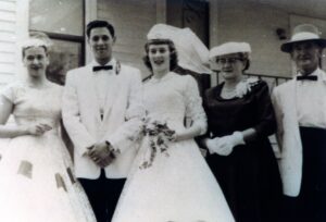 Vintage wedding portrait: bride, groom, family