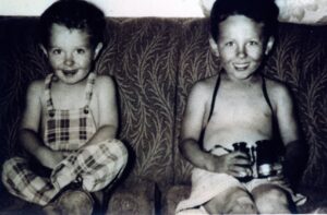 Vintage snapshot of two boys on couch