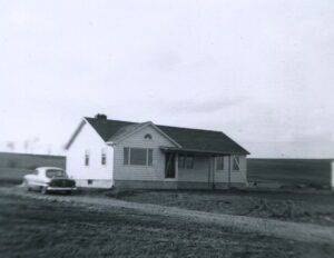 Midcentury rural house with vintage car