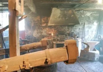 Rustic blacksmith forge with anvil and bellows