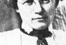 Vintage black-and-white portrait of woman with glasses