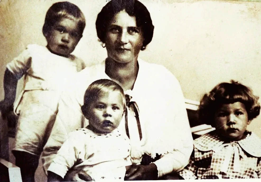 Vintage mother with three young children portrait