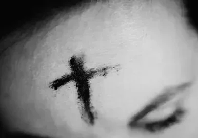Close-up of ash cross on forehead