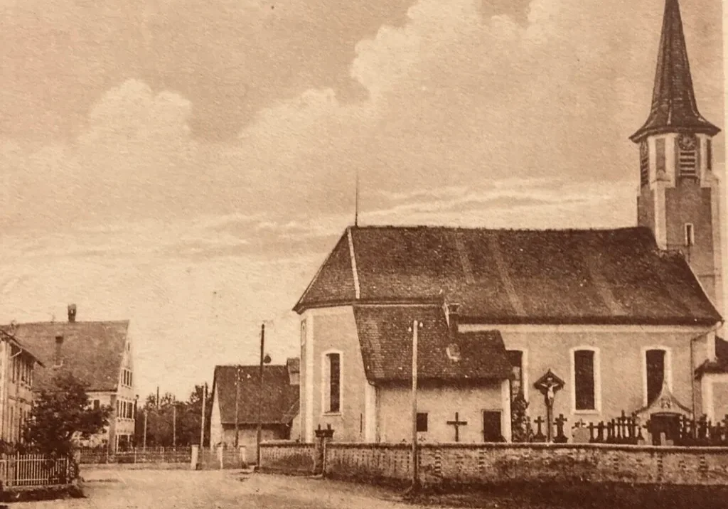 Vintage sepia village church with cemetery